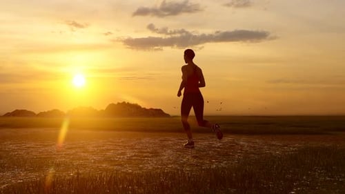 Female Runner in Golden Sunset Nature Landscape