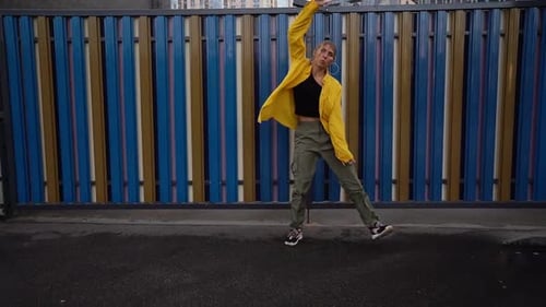 Energetic Woman Dancing Outdoors in Urban Fashion Style