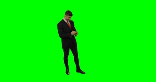 Man Using Smartphone on Green Screen Background