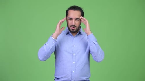 Stressed Man Massaging Temples on Green Screen