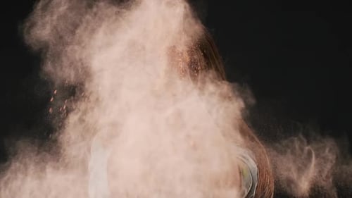 Portrait of Delighted Woman Making Splash with Colorful Powder and Celebrating Holi Spring Festival