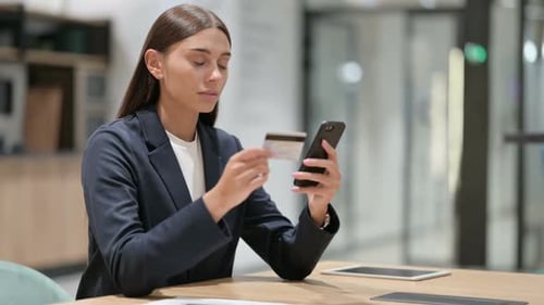 Woman Using Credit Card for Mobile Online Shopping