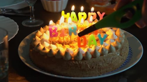 Birthday Cake Candles Being Lit for Celebration