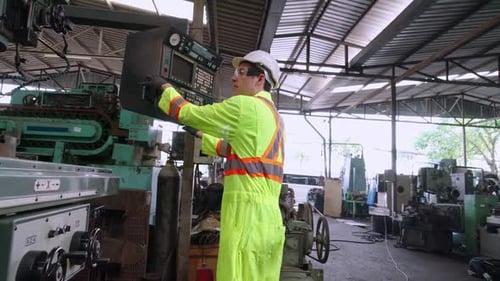Smart Factory Worker Using Machine in Factory Workshop