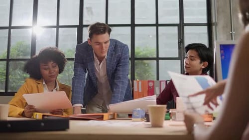 Business Professionals Collaborate in Bright Modern Office