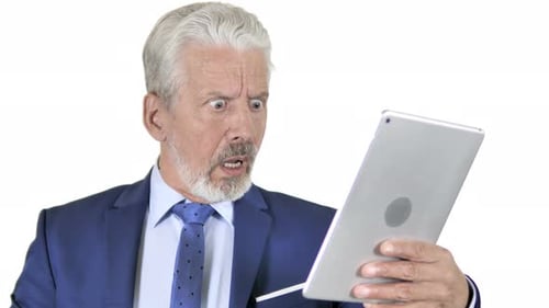 Senior Man Shocked Using Tablet Device