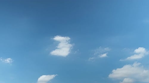 Clouds Drifting Across Blue Sky During Daytime