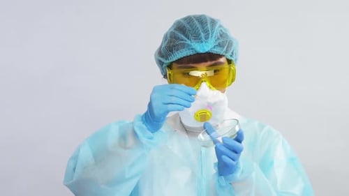 Scientist Works With Petri Dish and Syringe
