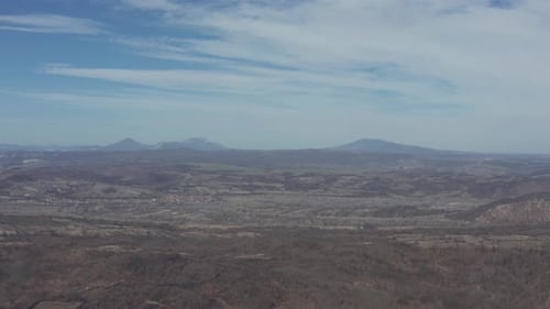 Settled meadow with mountains Stol Veliki Krsh and Deli Jovan 4K aerial video