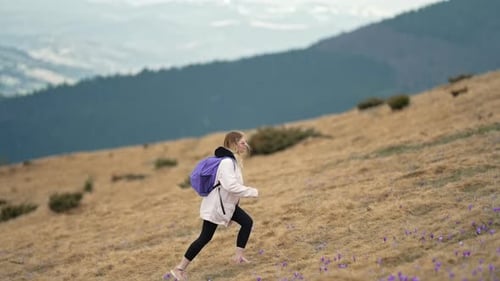 Young Traveller Woman Climbs Up Hiking in Mountain Alone
