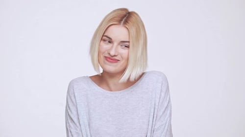 Smiling Blonde Woman Looking to the Side