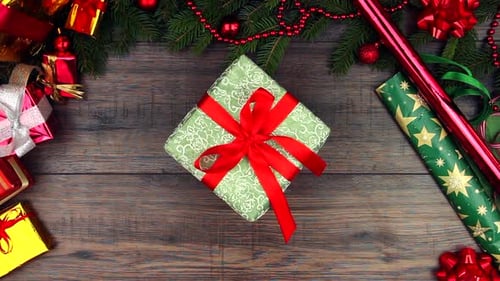 Christmas Gift with Red Ribbon Picked Up and Set Down