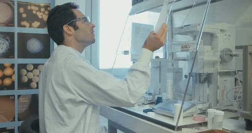 Scientist working in a pharmaceutical laboratory weighing chemicals