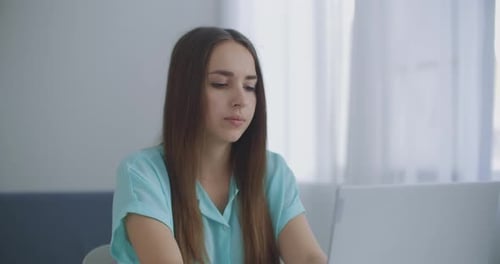 Businesswoman With Laptop In Her Office At The Desk, Working. Business Woman Works on Laptop
