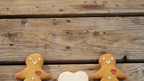Gingerbread cookies arranged on wooden table