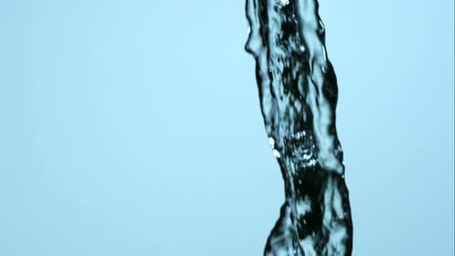 Abstract Stream of Clear Water Against Blue Backdrop