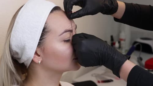 Eyebrow Threading Shaping Procedure in Beauty Salon