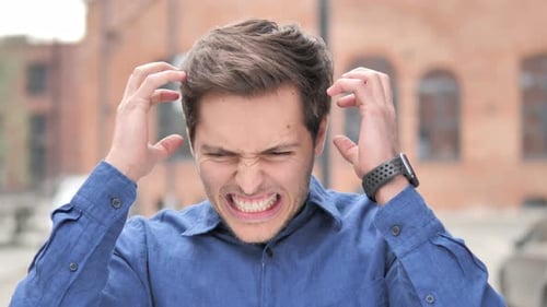 Frustrated Man Yelling and Pulling at His Hair