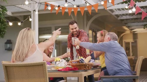Family Cheers at Backyard Gathering Celebration