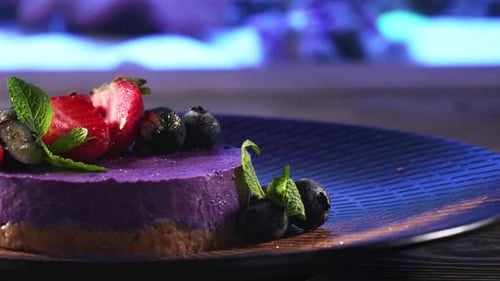 Purple Berry Dessert Garnished with Fresh Fruit
