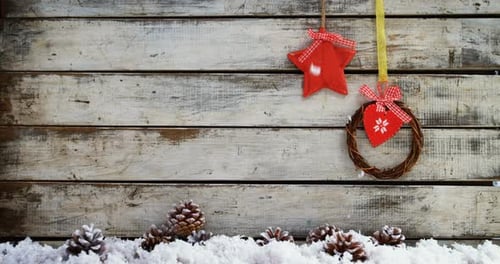 Wreath and heart shape decoration hanging on a plank 4k
