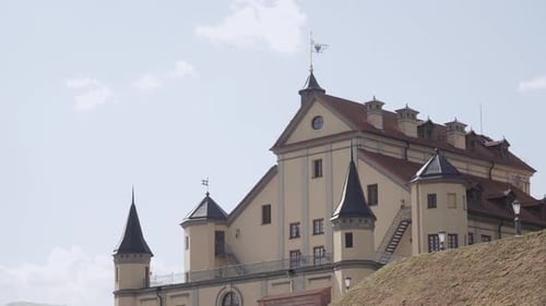 Renovated Old Architectural Palace with Towers in Sunny Weather