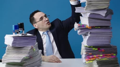 Office Clerk in a Jacket and Glasses Is Upset About the Upcoming Work.