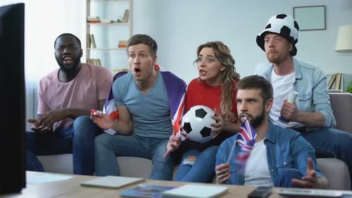 Friends Excitedly Watching Sports on TV at Home