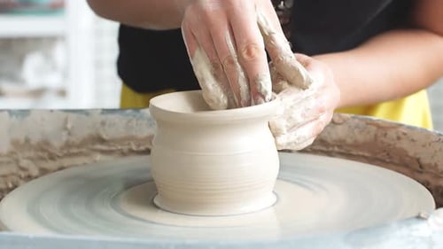 Creating a Clay Pot, Potter, Workshop of Clay, Clay on the Device. Hands Working on Pottery Wheel
