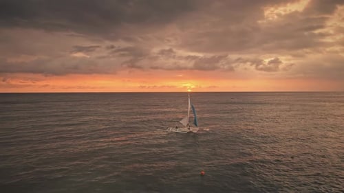 Colorful Sunset Above Sea with Sail Boats Aerial
