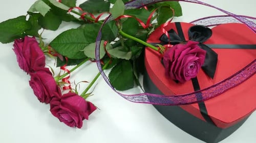 Romantic Roses and a Heart Shaped Gift Box