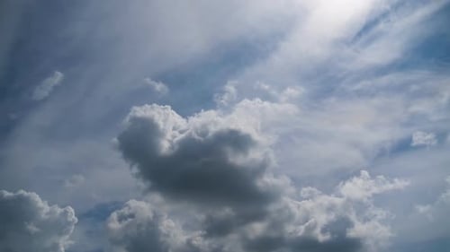 White Clouds Drifting Across a Blue Sky