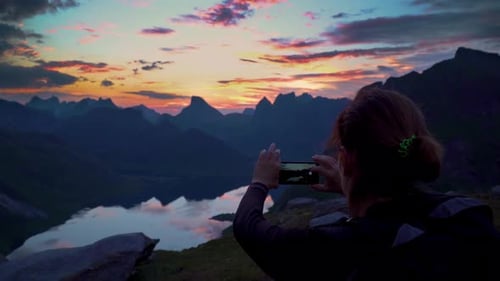 Hiker Reaches Mountain Peak, Takes Picture of Sunset