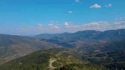 steep green mountains, deep forest and mountain road, beautiful valley