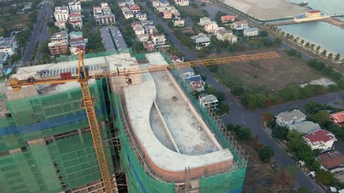 Aerial Shot of the Construction Site with One Onstruction Crane. Tall Building Construction Concept