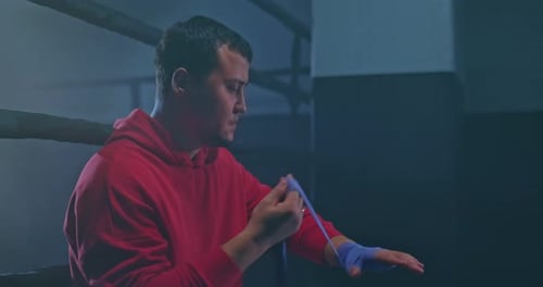 Boxer Wraps Hands Before Boxing Match