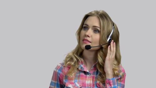 Woman With Headset Talking On The Phone