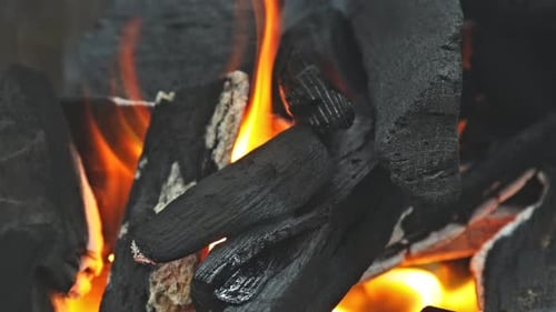 Burning Charcoal Embers and Flames Close-Up