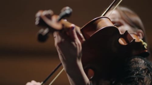 Woman Playing Violin Close Up