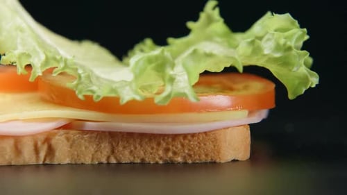 Ham, Cheese, Tomato, and Lettuce Sandwich Preparation