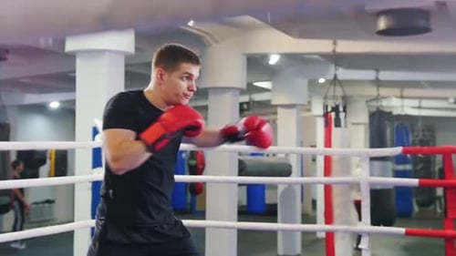 Man Shadow Boxing in Gym Boxing Ring