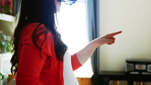 Woman Wearing VR Headset Points Finger