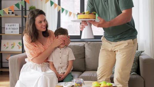 Family Celebrating a Child's Birthday at Home