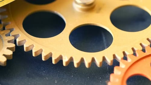 clock 's mechanism: wheels spinning together-macro