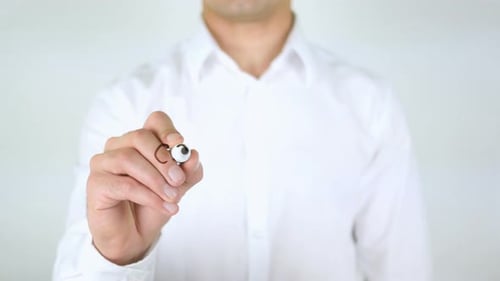 Man Writes Coordination on Clear Surface With Marker