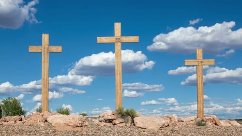 Three Wooden Crosses Against a Sunny Blue Sky