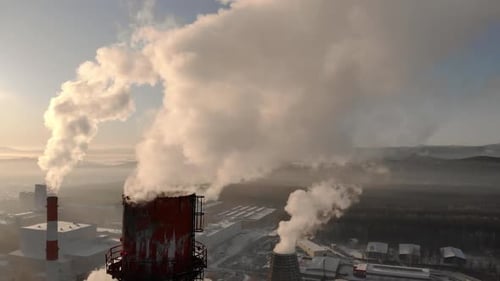 View of the Thermal Power Plant with Smoking Chimneys Filmed with a Wide Angle Lens