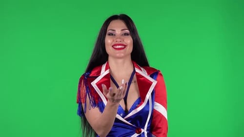 Smiling Woman Posing in Front of Green Screen