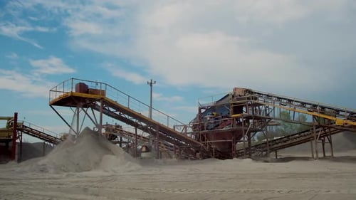 Industrial factory for gravel production. Metal construction for working with stone and rocks. Eleme