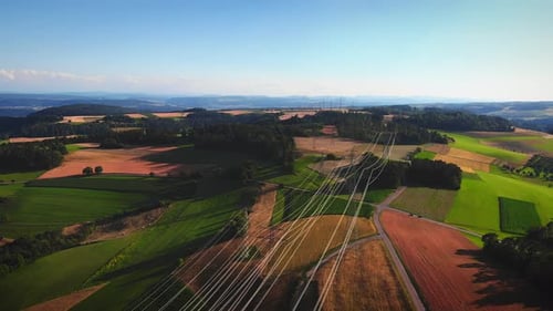 Aerial View of Rural Fields and Powerlines